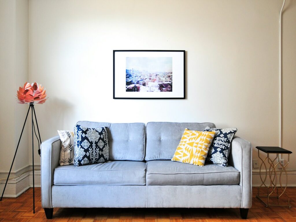 Light blue sofa with patterned cushions in a bright living room