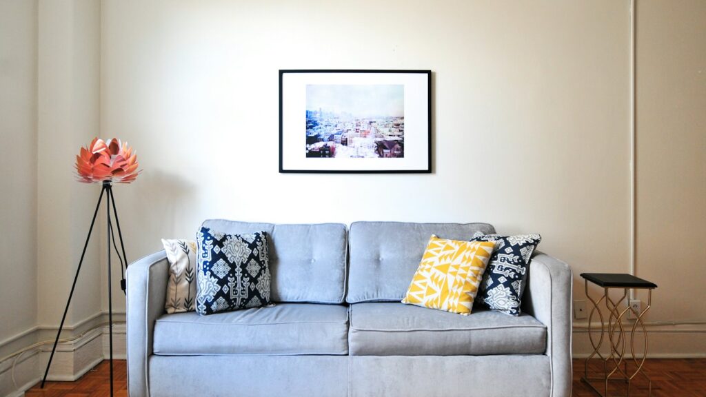 Light blue sofa with patterned cushions in a bright living room