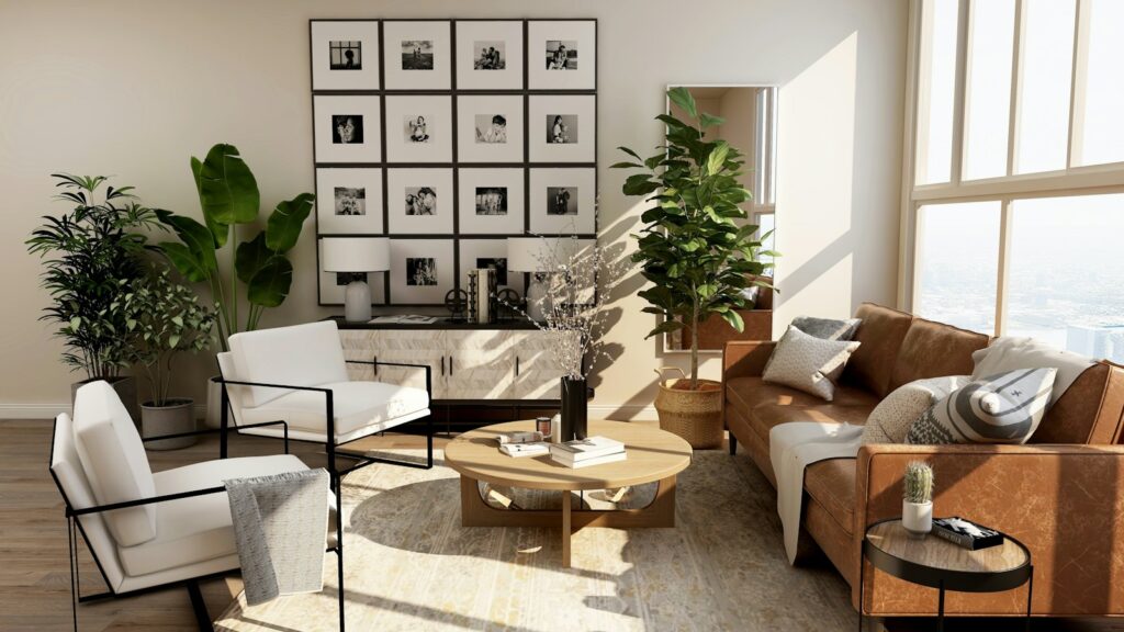 Sunny living room with a leather sofa, plants and framed photographs