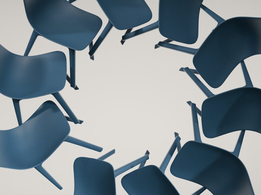 Blue chairs arranged in a circle, seen from above